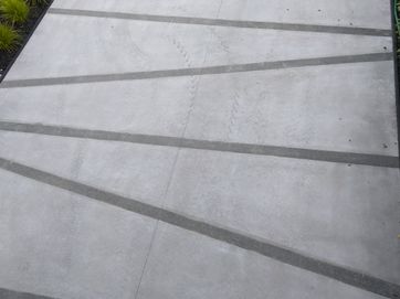 Acid wash concrete driveway with exposed aggregate pattern.